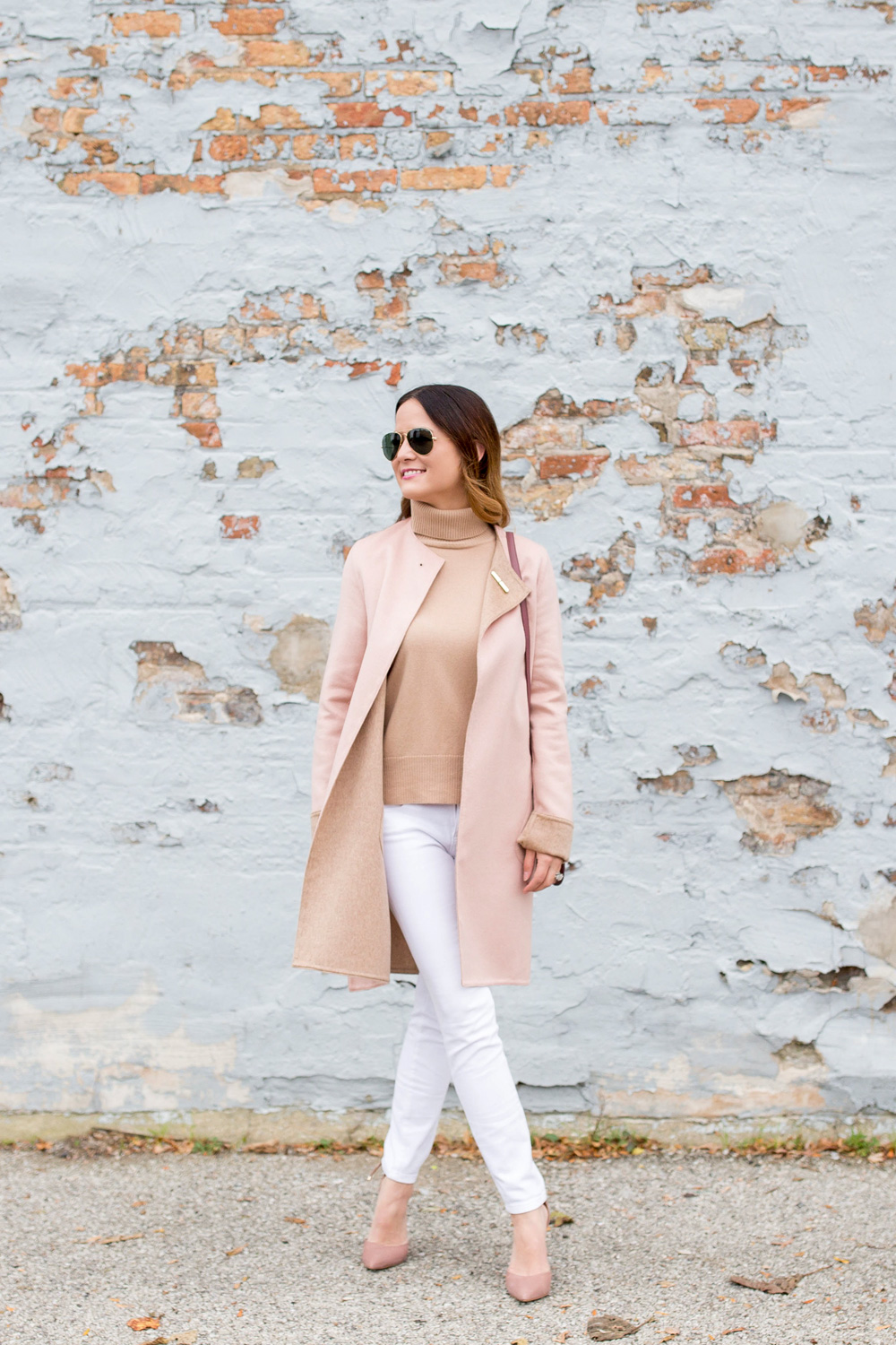 Jennifer Lake Style Charade in a Cuyana cashmere coat, turtleneck, and white denim