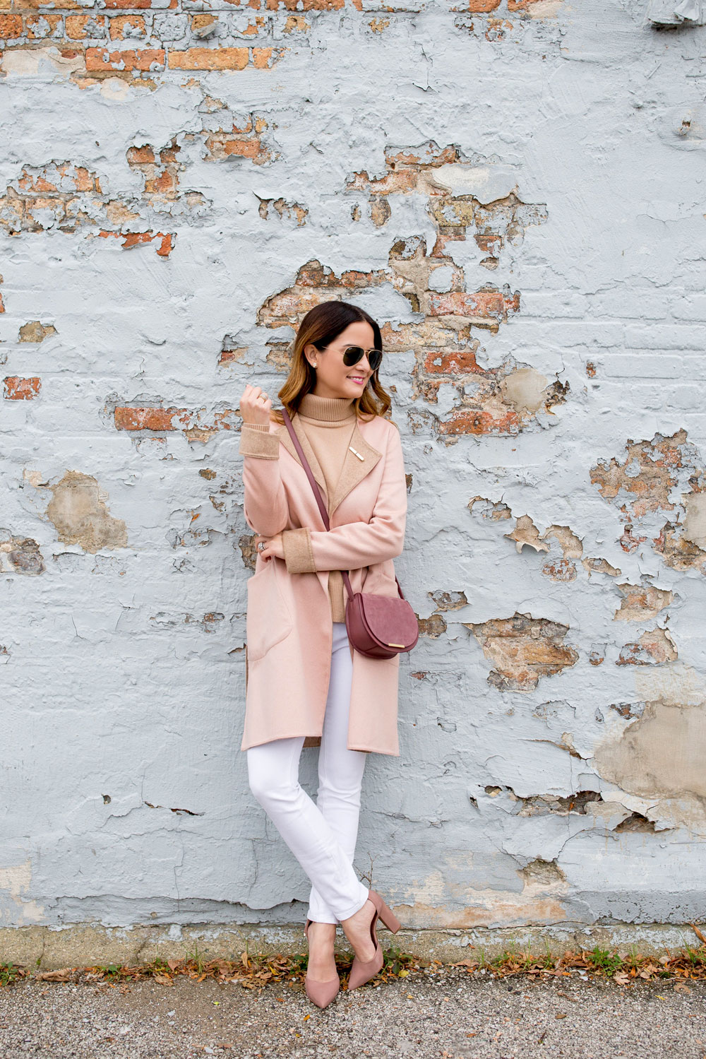 Jennifer Lake Style Charade in a pink Cuyana saddle bag from the Chicago pop up store