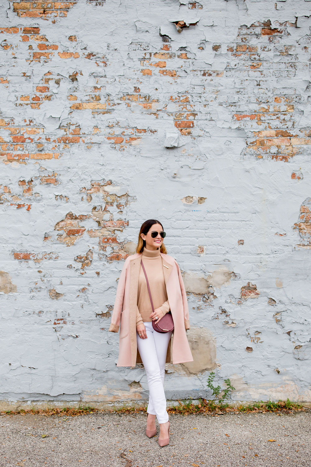 Jennifer Lake Style Charade in a Cuyana turtleneck sweater and saddle bag