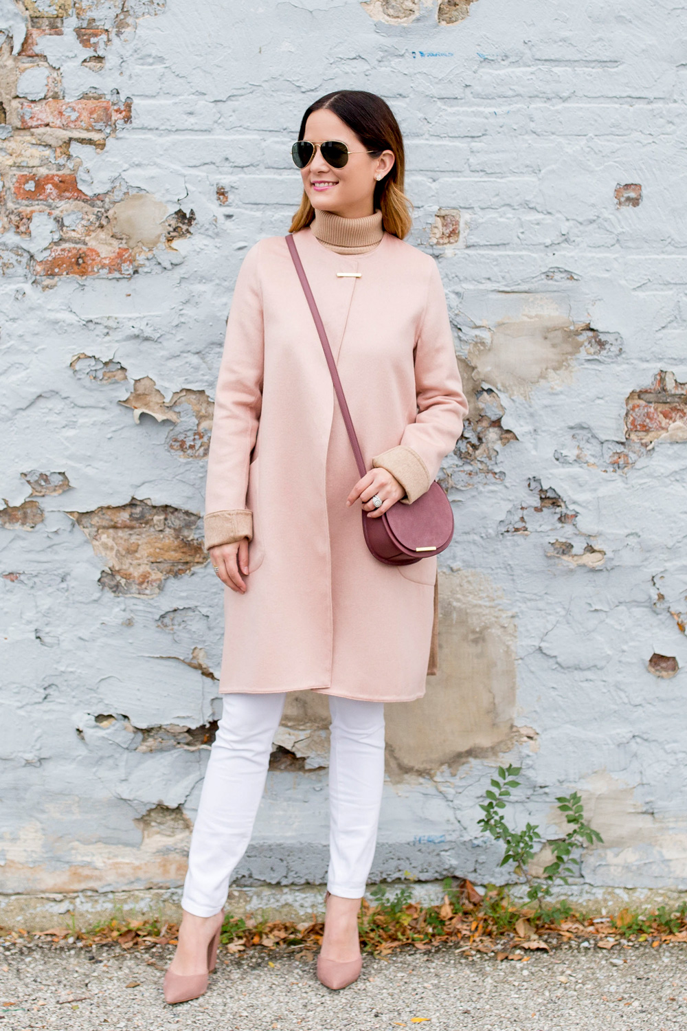 Jennifer Lake Style Charade in a Cuyana coat and dusty rose mini saddle bag