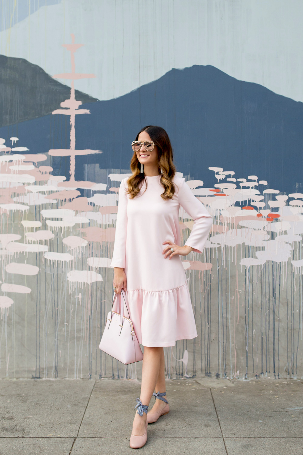 Jennifer Lake Style Charade in a pink Edit Easy Dress from Shopbop, Steve Madden Meow tie up flats, a pink Kate Spade Maise bag at Los Angeles Kim West mural street art