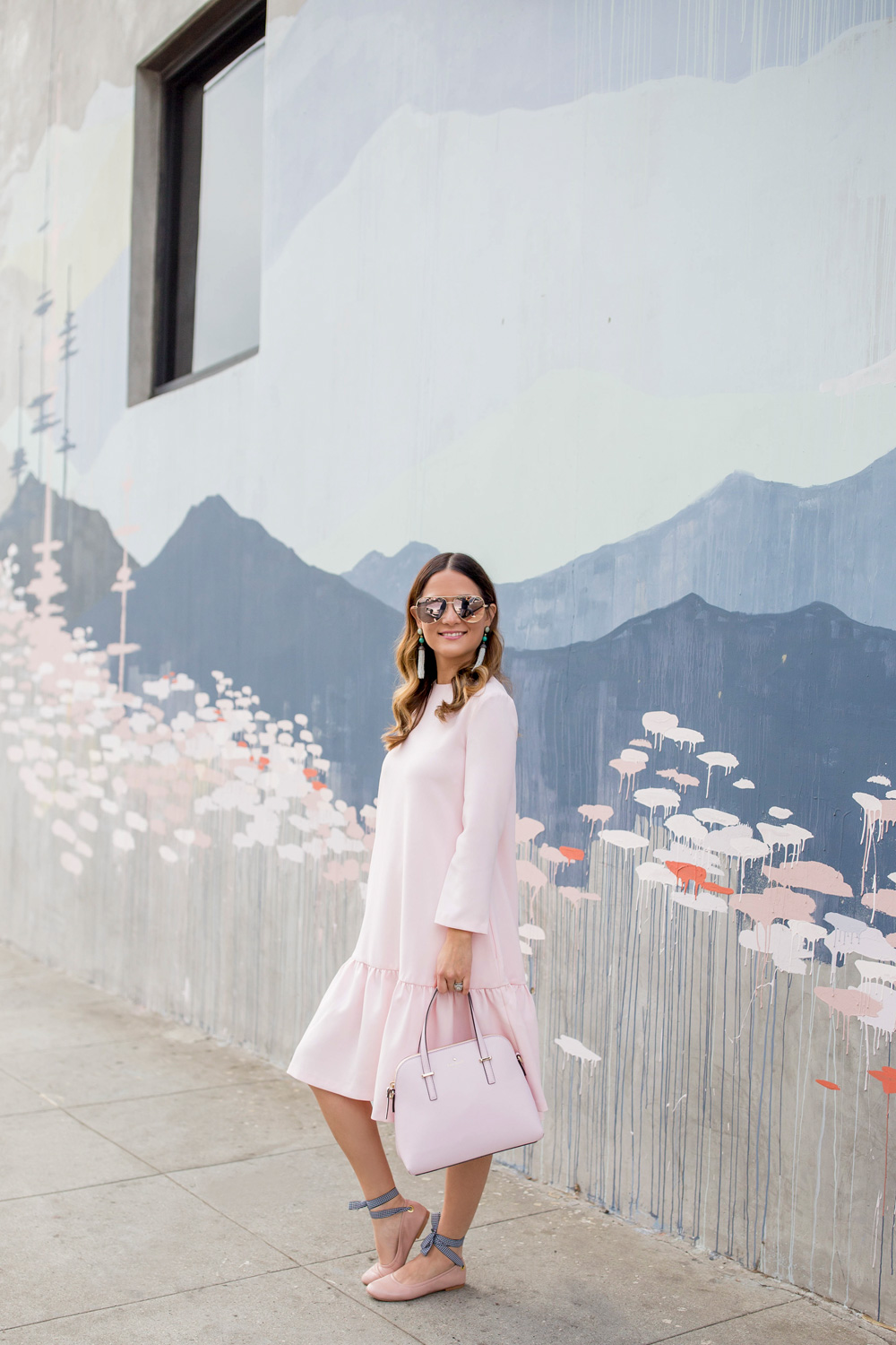 Jennifer Lake Style Charade in a pink Edit Easy Dress from Shopbop, Steve Madden Meow tie up flats, and a pink Kate Spade bag at a Los Angeles Kim West mural street art