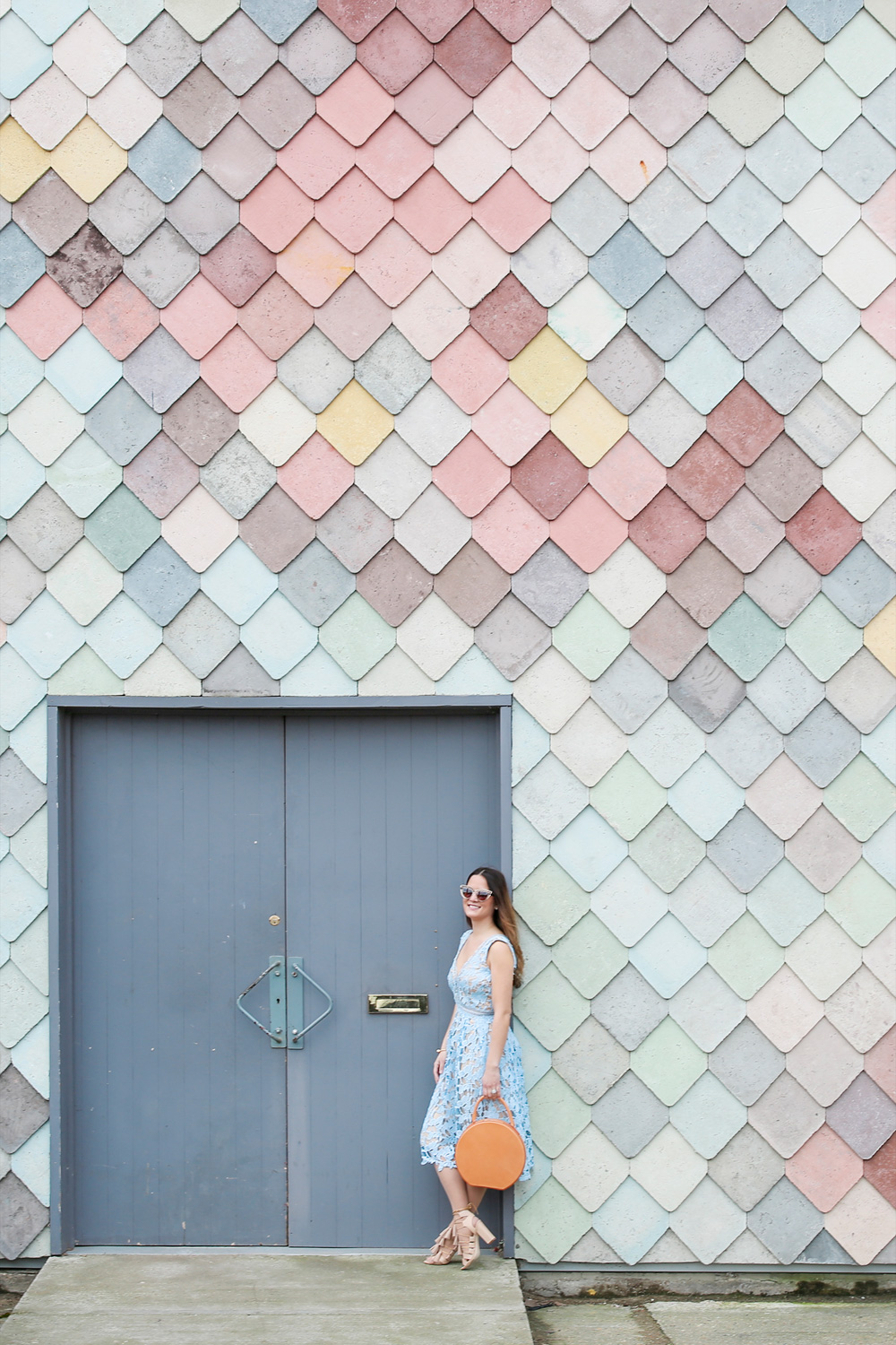 Jennifer Lake Style Charade in a lace dress, Mansur Gavriel Circle bag, and Loeffler Randall Tassel sandals at Sugarhouse Studios London