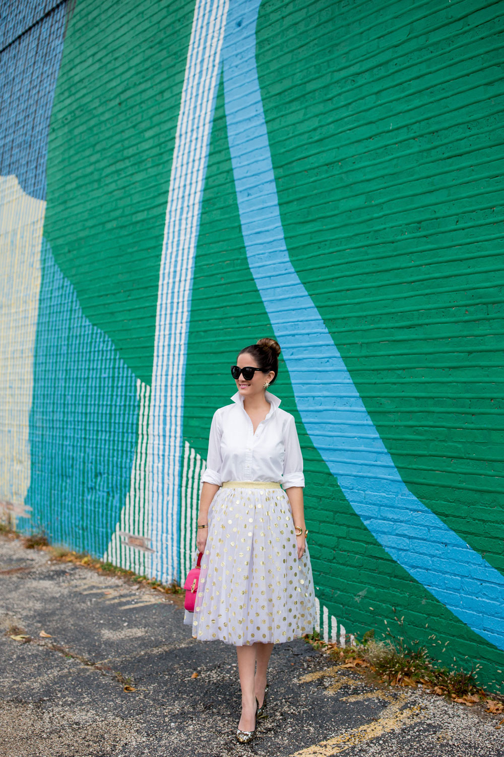 Jennifer Lake Style Charade in a T and J Designs gold glitter polka dot midi skirt, Henri Bendel Uptown Satchel and J Crew sequin pumps at a colorful Chicago mural