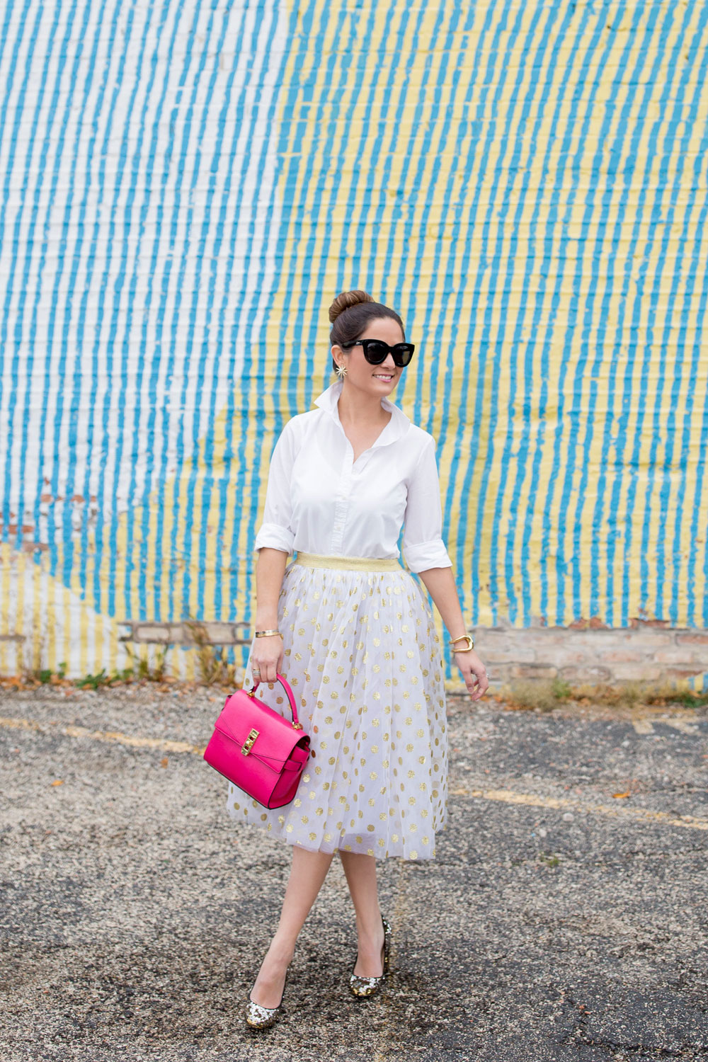 Jennifer Lake Style Charade in a T and J Designs gold glitter polka dot midi skirt, Henri Bendel Uptown Satchel and J Crew sequin pumps at a colorful Chicago mural