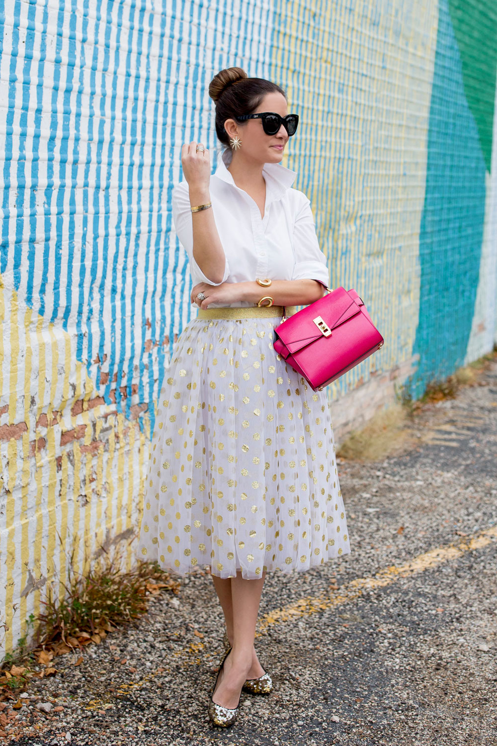 Jennifer Lake Style Charade in a T and J Designs gold glitter polka dot midi skirt, Henri Bendel Uptown Satchel and J Crew sequin pumps at a colorful Chicago mural