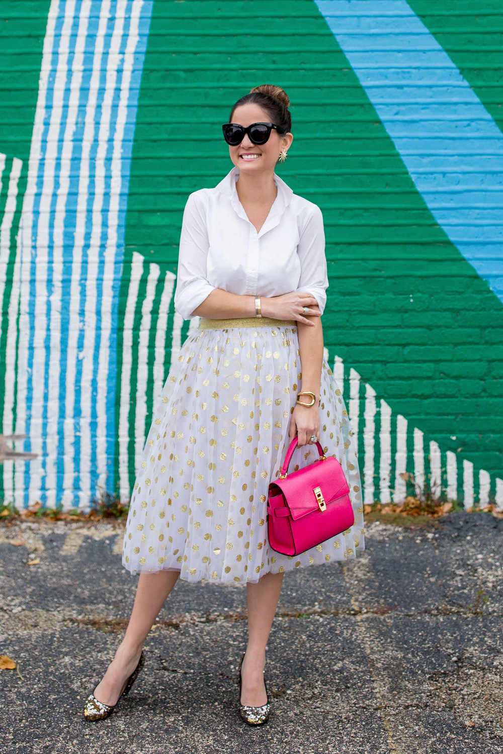 Jennifer Lake Style Charade in a T and J Designs gold glitter polka dot midi skirt, Henri Bendel Uptown Satchel and J Crew sequin pumps at a colorful Chicago mural