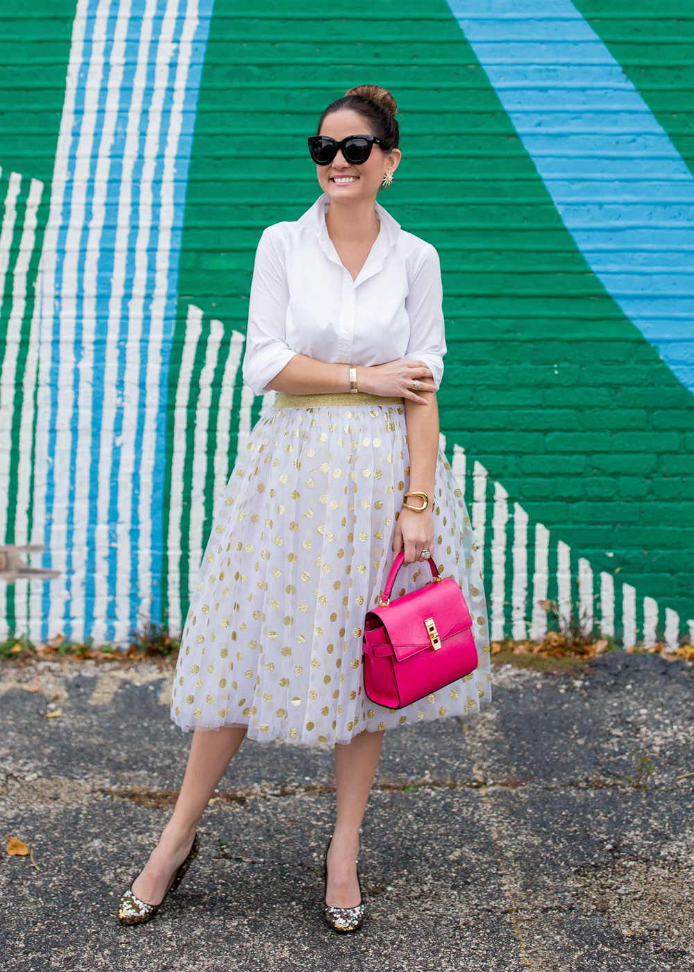 Jennifer Lake Style Charade in a T and J Designs gold glitter polka dot midi skirt, Henri Bendel Uptown Satchel and J Crew sequin pumps at a colorful Chicago mural