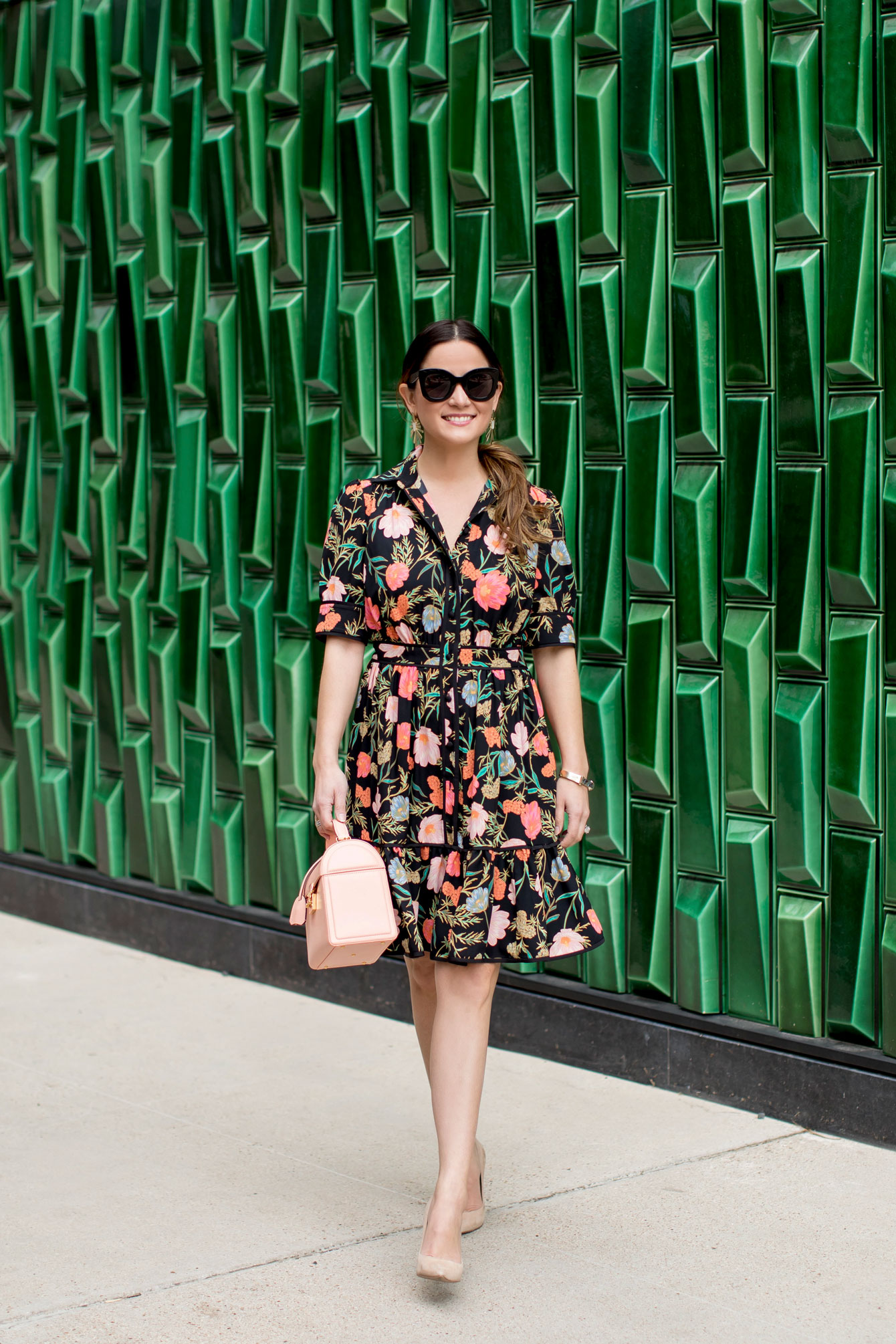 Green Floral Dress: a plus size summer outfit featuring a green floral dress  and wide fit straw hat from Torrid, and a dark green Kate Spade handbag.